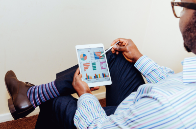 Person reviewing charts on a tablet